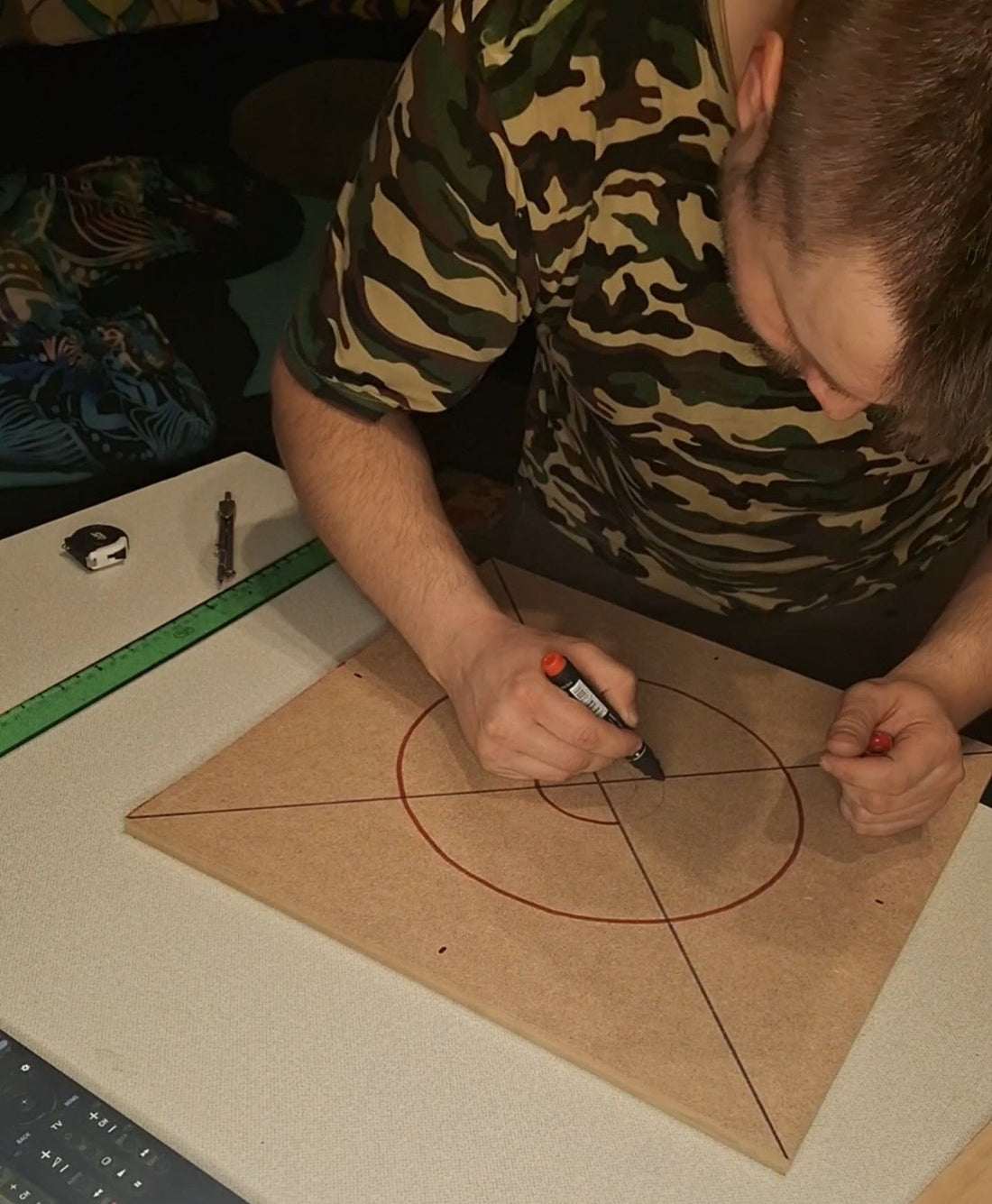 Artist marking geometric pattern on MDF board – handmade string art preparation process by Psybell