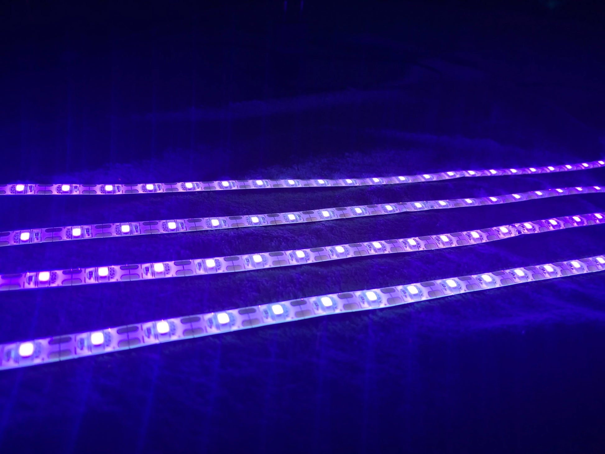 Ultra-violent LED strip lights on a dark background