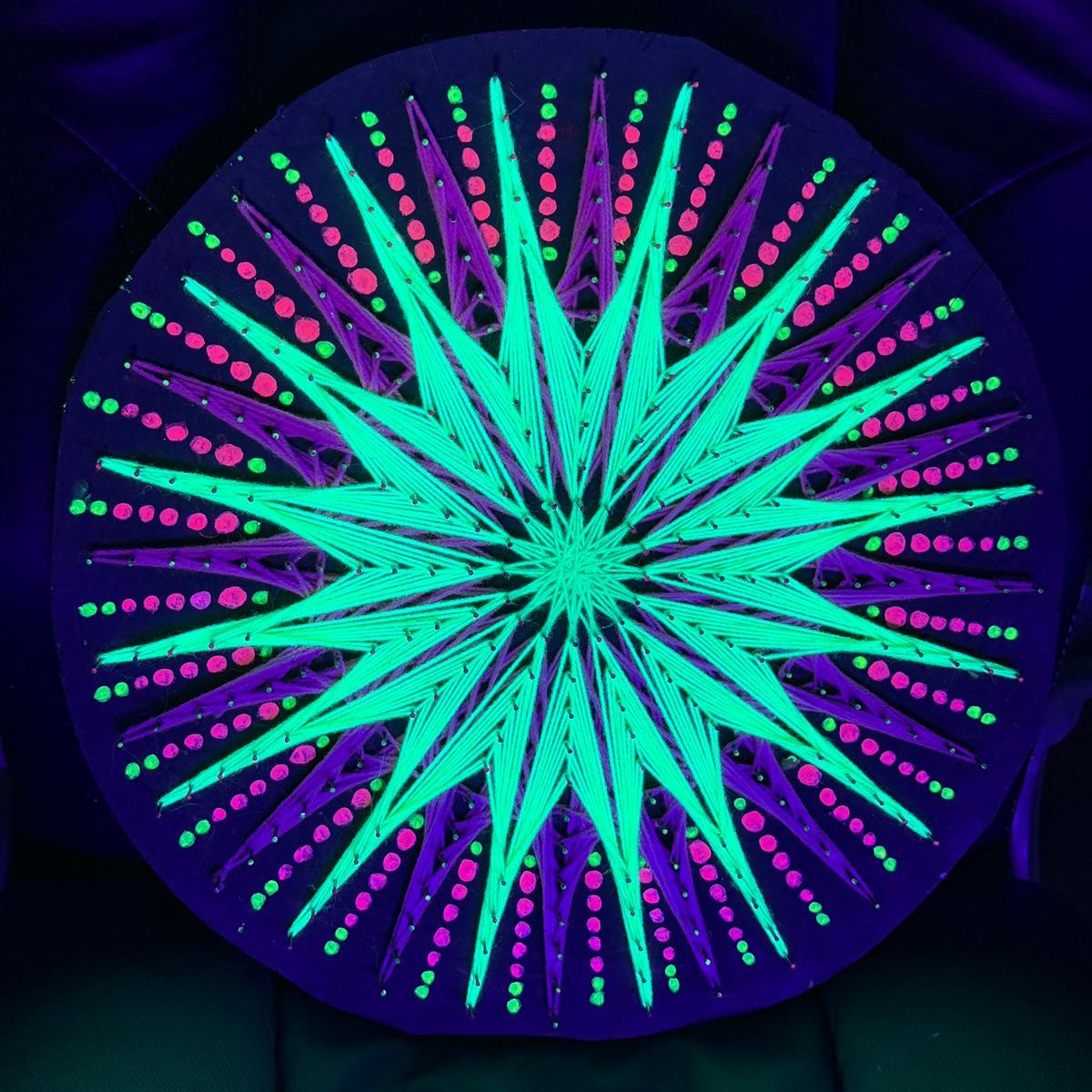 Jellyfish Pattern UV reactive string art mandala glowing neon purple and lime green under blacklight, psychedelic geometric wall decoration