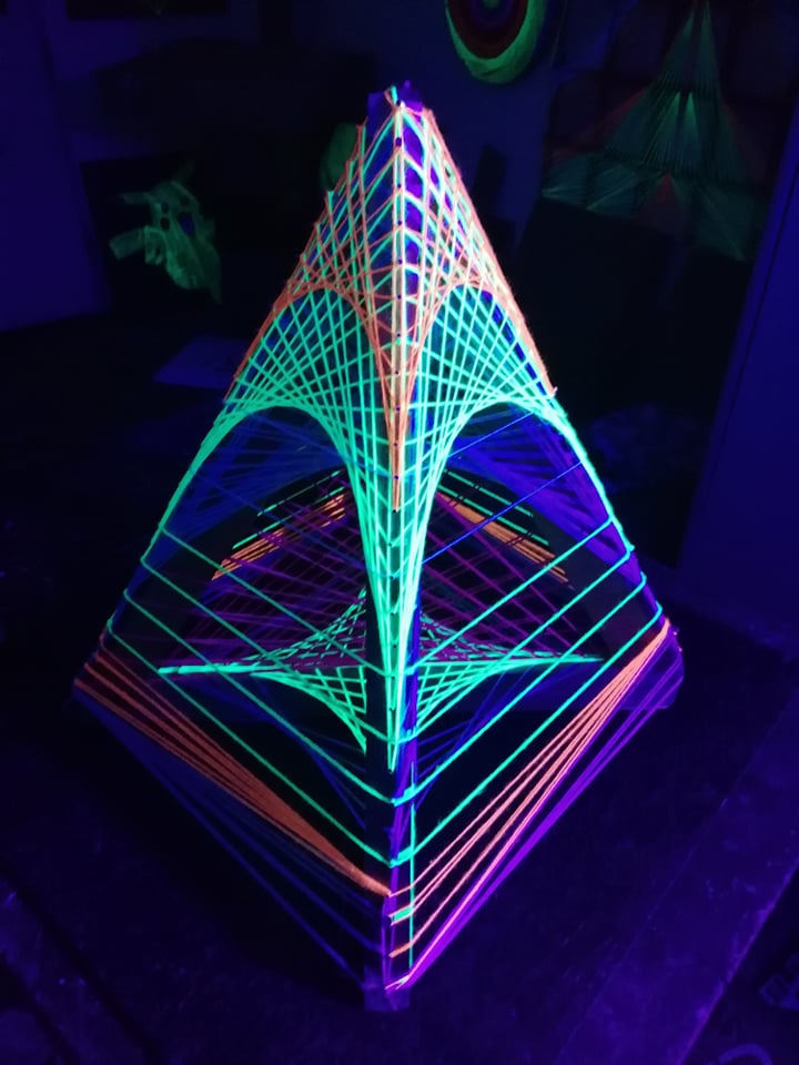 Little pyramid string art sculpture, handmade 3D geometric form with UV reactive threads by Psybell
