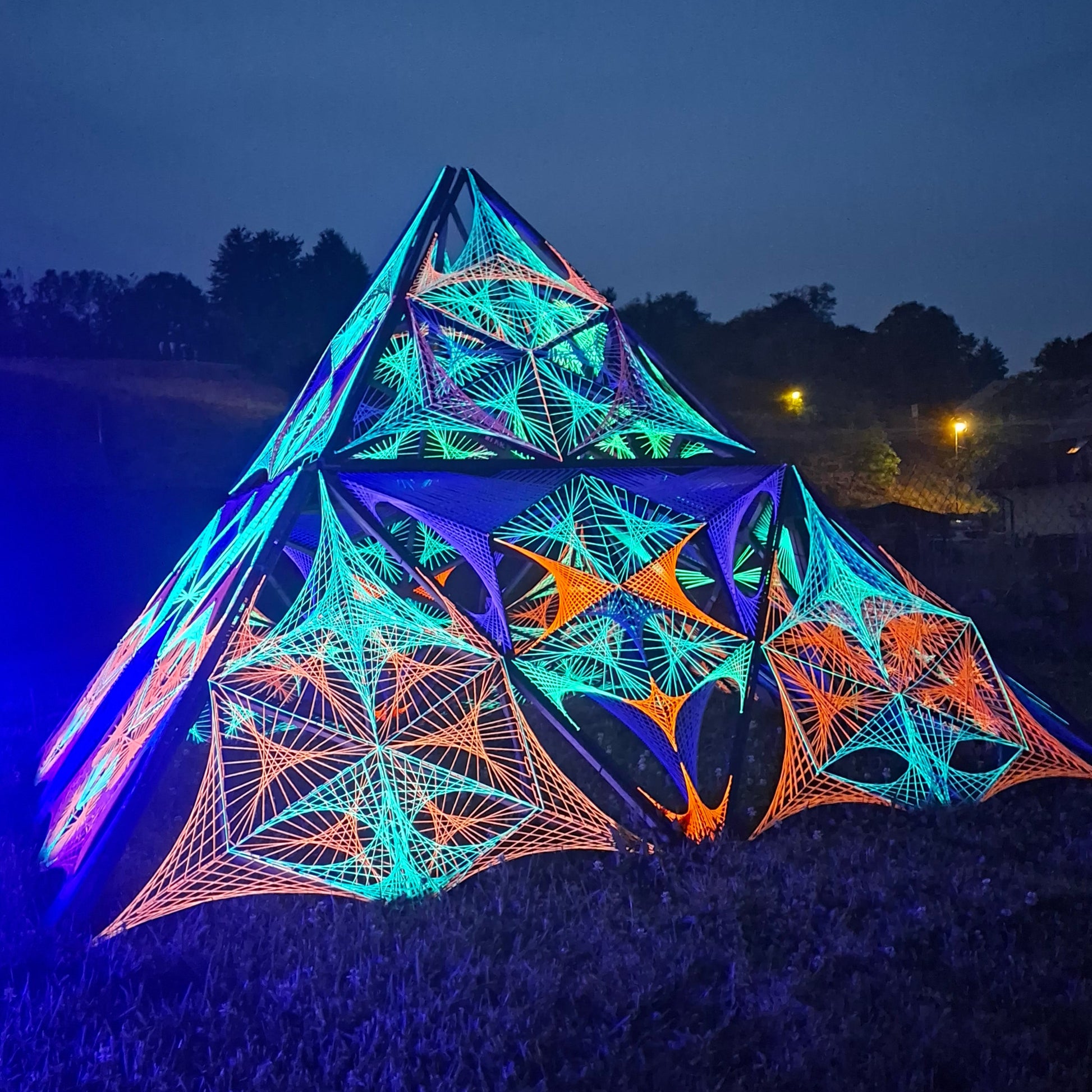 Psybell Pyramid UV reactive 3D string art, glowing geometric pyramid sculpture made with neon threads, handmade modular UV installation