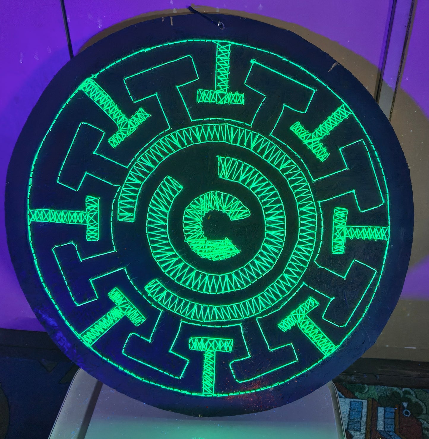 Fluorescent green UV string art Labyrinth mandala geometric wall art detail on black wooden board