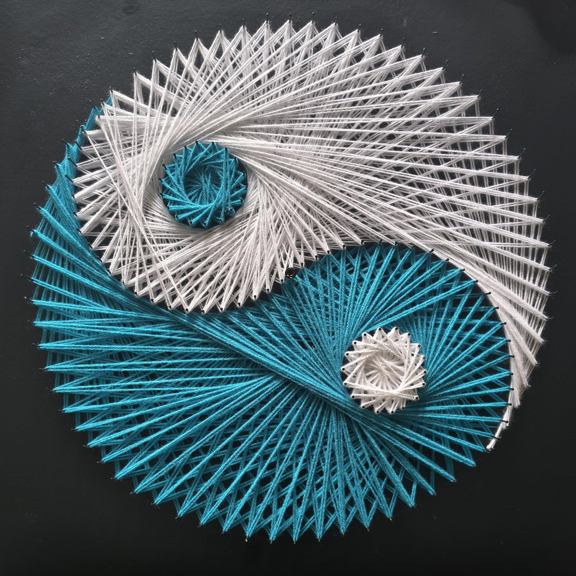 Load video: Short time-lapse video of handmade string art creation, geometric thread weaving process on wooden board, Psybell studio