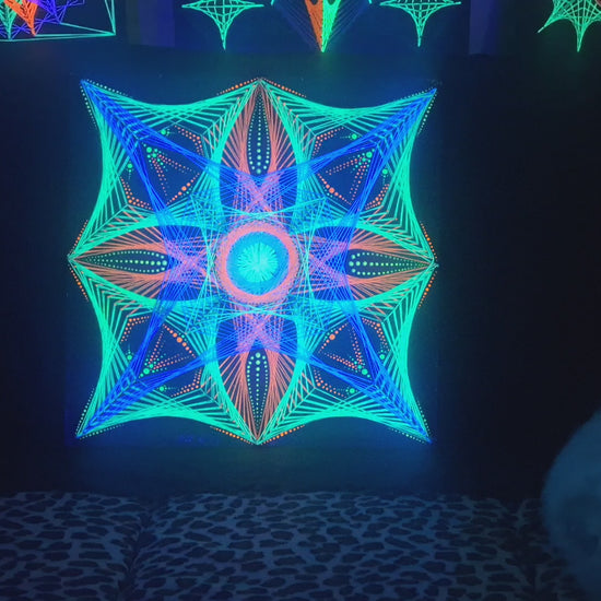 UV glow video of geometric string art mandala “Aura Flow” by Psybell glowing under blacklight showing hypnotic handmade thread patterns