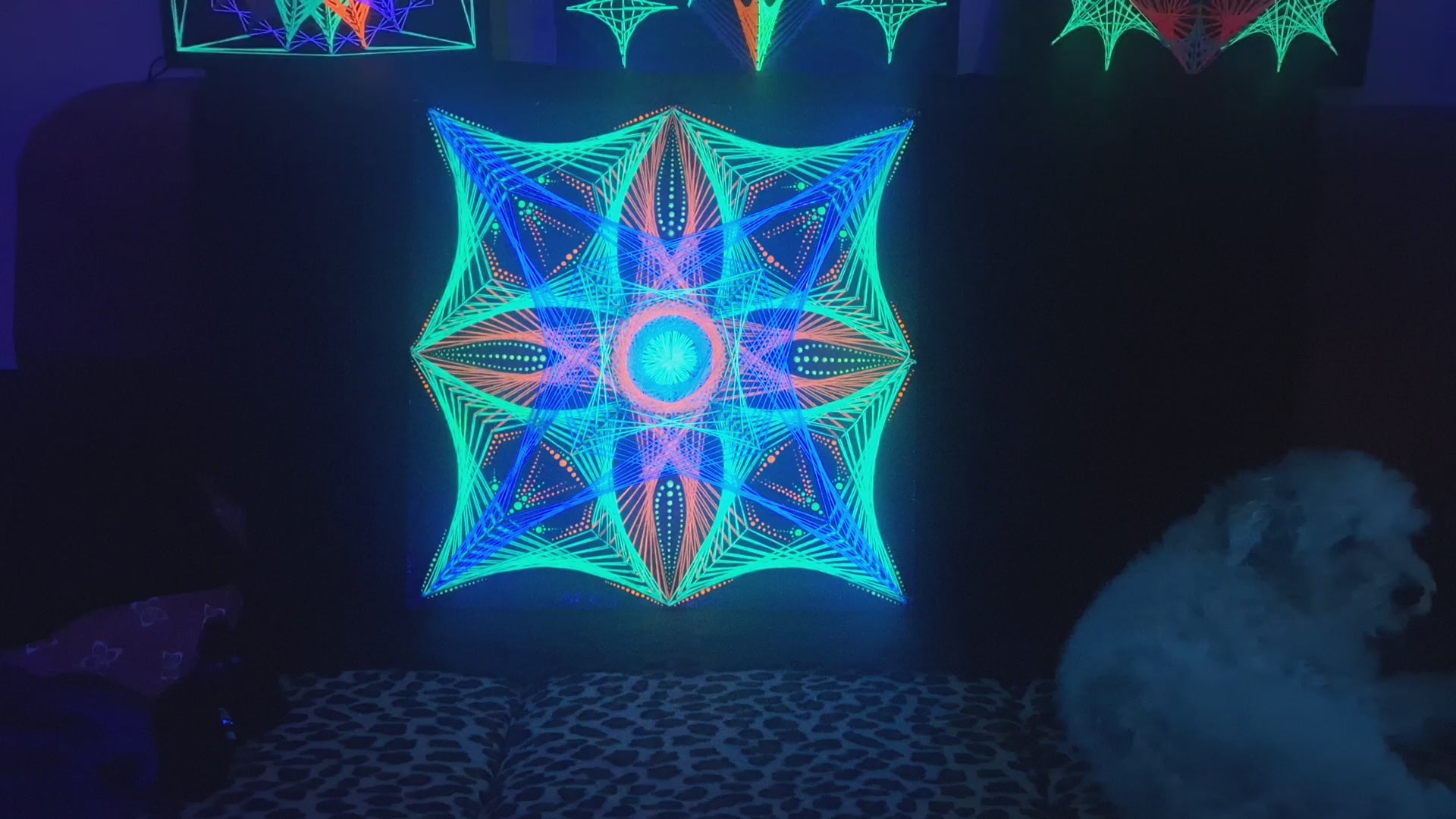 UV glow video of geometric string art mandala “Aura Flow” by Psybell glowing under blacklight showing hypnotic handmade thread patterns