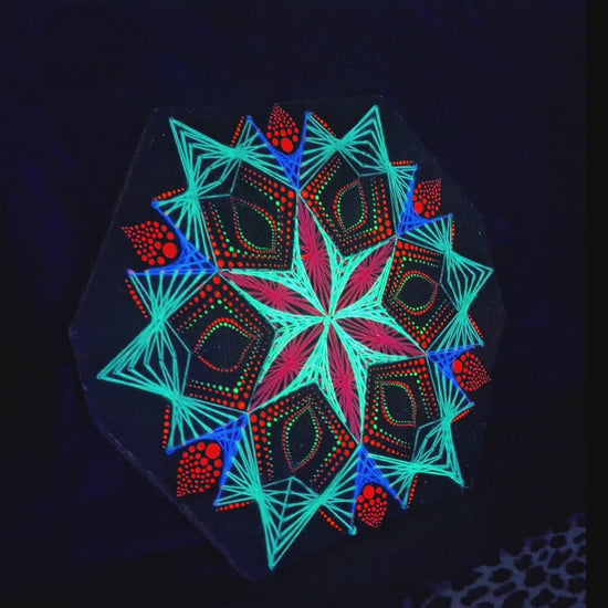 Macro detail video of geometric string art mandala “Blooming Anise” by Psybell showing handmade threads and dotted mandala pattern on wooden board