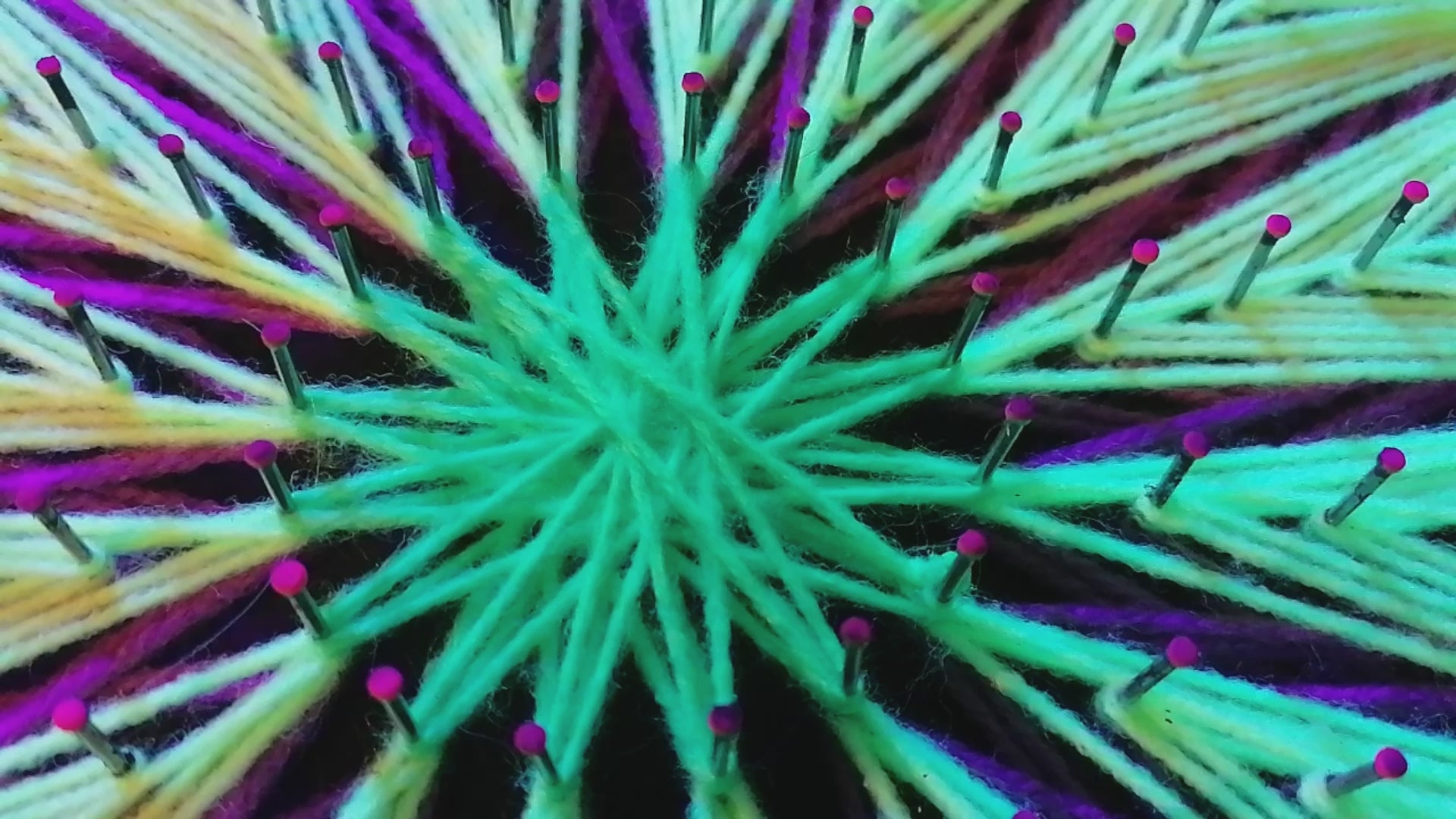 Jellyfish Pattern UV string art mandala – detailed neon purple and lime green radial geometry glowing under blacklight, handmade wall art