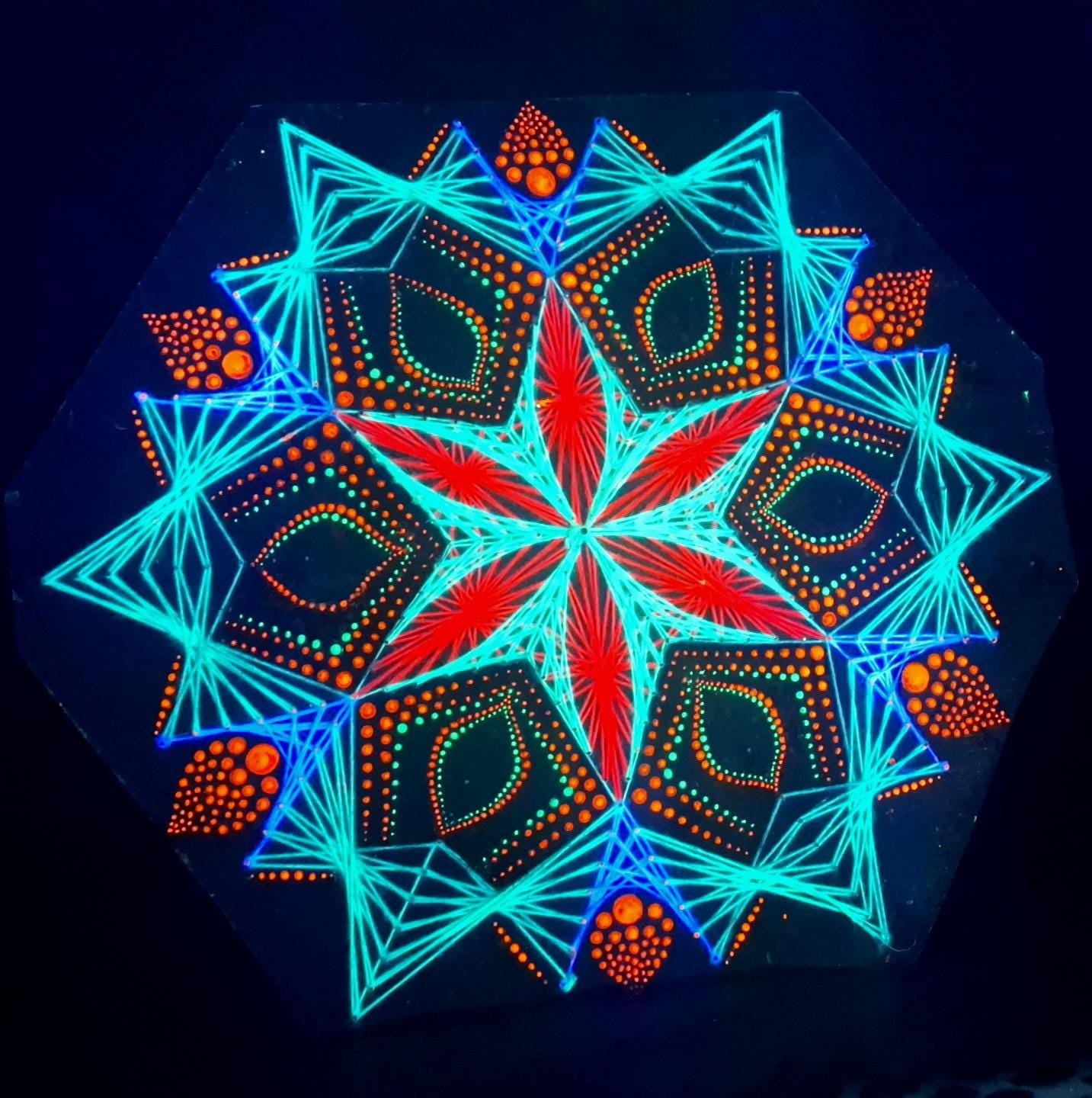 Blooming Anise UV reactive string art mandala with dotted pattern, handmade geometric wall art on wooden board, glowing threads and painted dots, Psybell