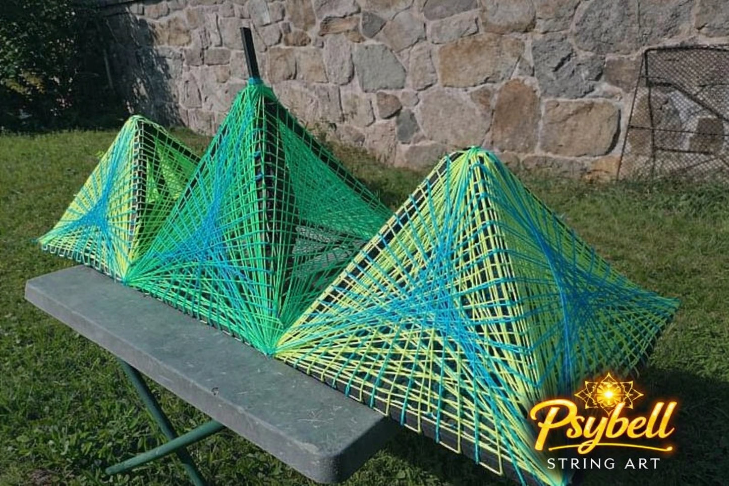 3D handmade string art Triple Pyramid by Psybell inspired by the pyramids of Giza featuring intricate cotton yarn weaving and complex geometric structure